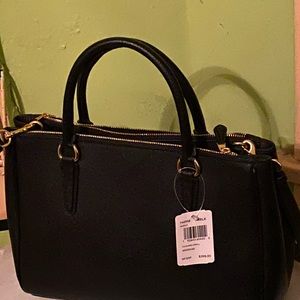 New coach purse color black.